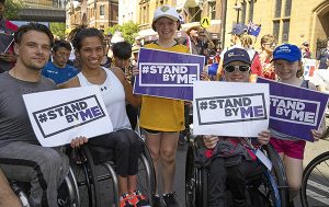 Attendees at 2019 Oz Day 10k holding Stand By Me signs