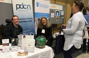 PDCN Board Member Jacob Cross, with Peer Support Project Officer Jane Scott and a member of the public at the ATSA Independent Living Expo.