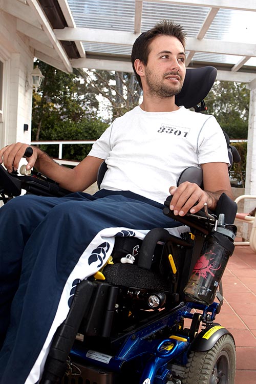 Man using motorised wheelchair on his porch