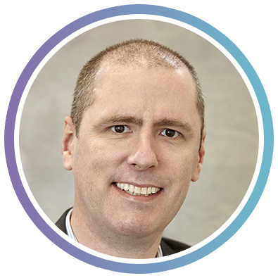 A headshot photo of Joshua Rhodes, Online and Social Media Officer