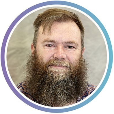 A headshot photo of Adrian O’Malley, Peer Facilitator and Mentor